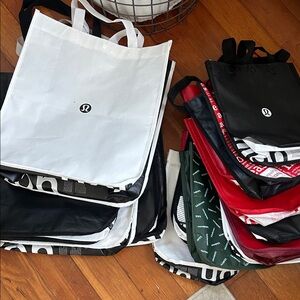 17 assorted lululemon Tote Bags (small and large)